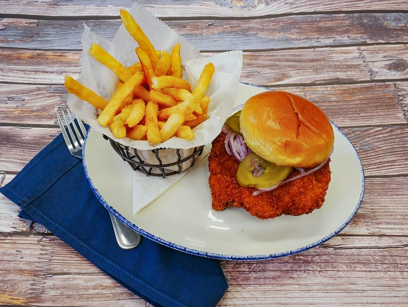 fried pork tenderloin sandwich with fries